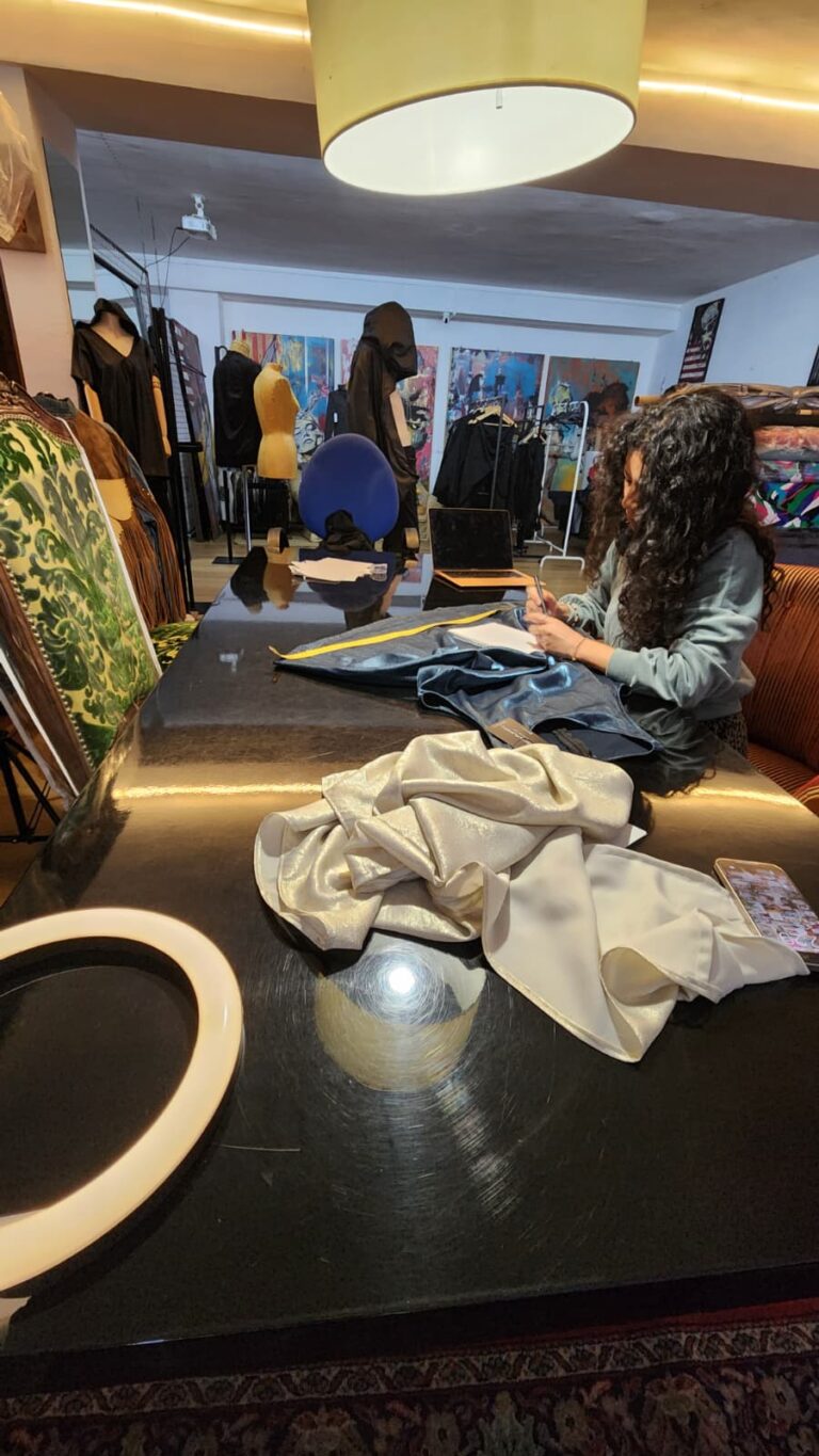 Creative studio workspace at Factory BCN with fashion garments, artworks, design materials and working area