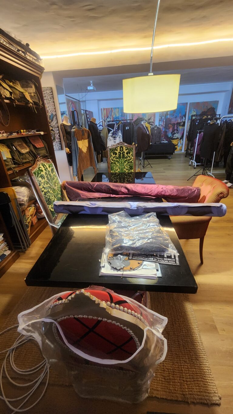 Creative studio workspace at Factory BCN with fashion garments, artworks, design materials and working area